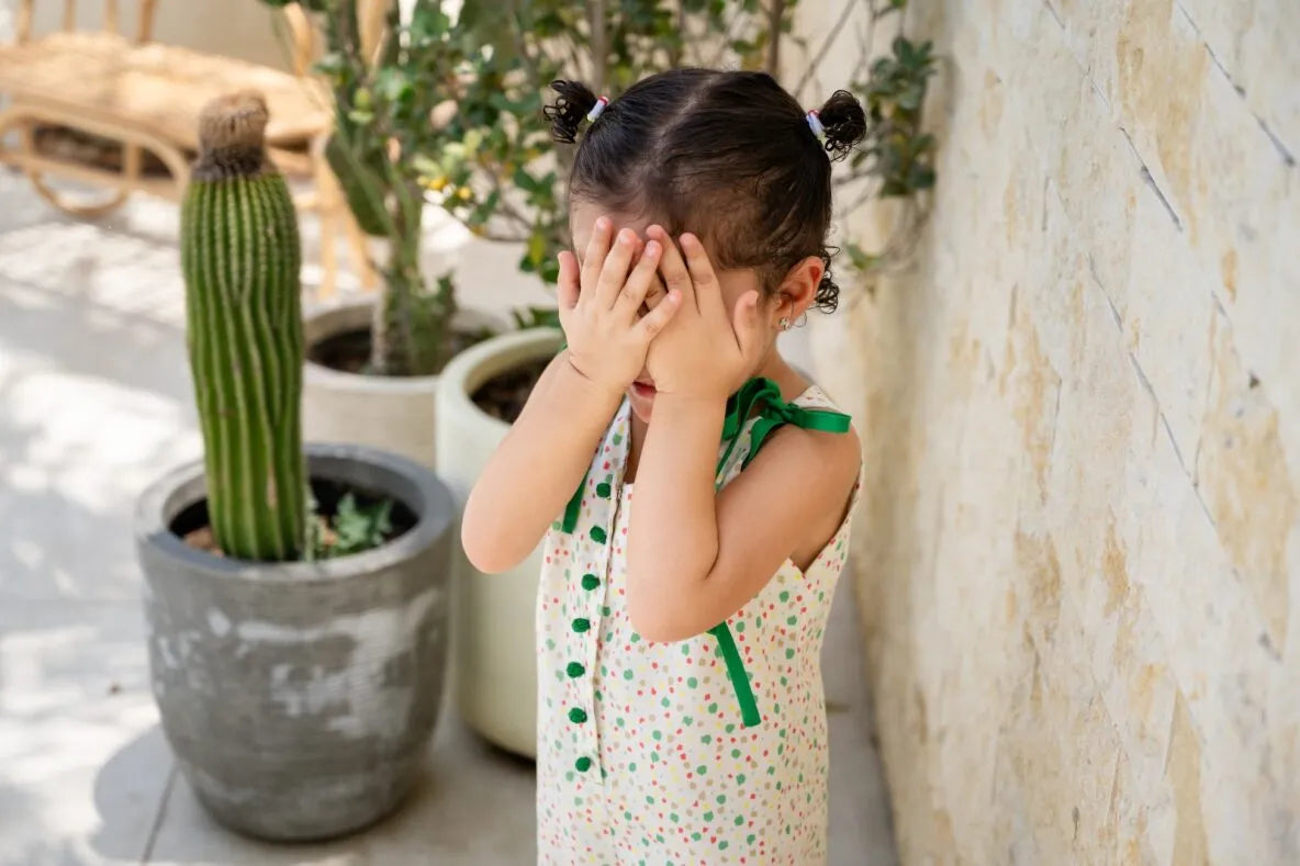 Child in dotted dress